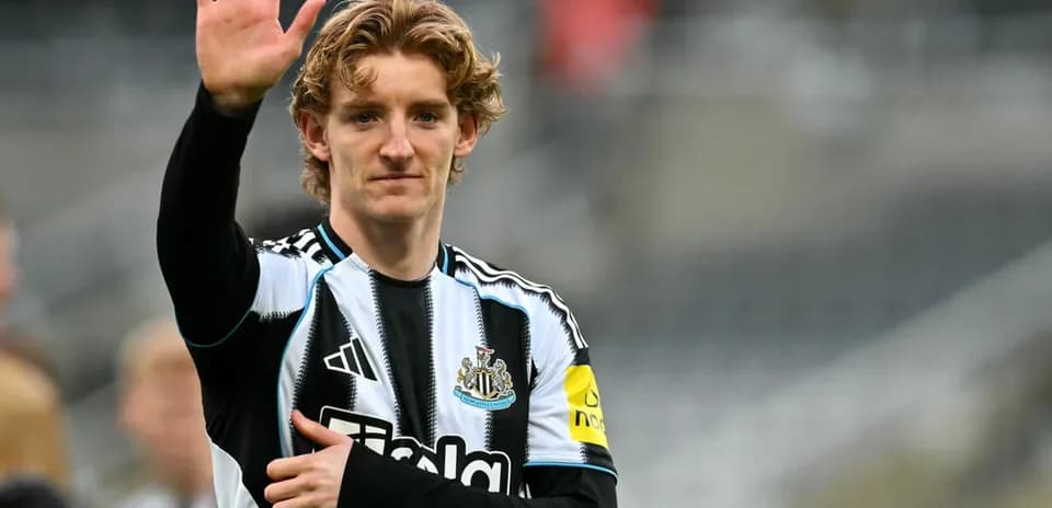 Player waving during warm-up at stadium