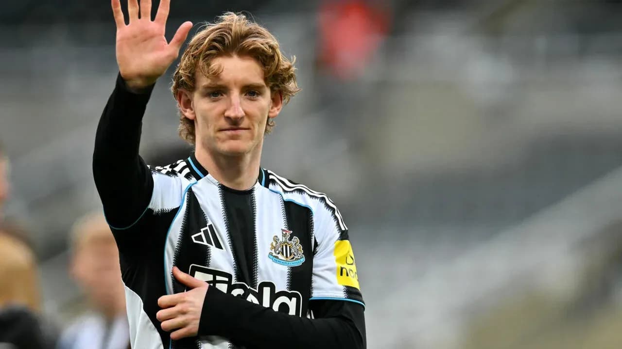 Player waving during warm-up at stadium
