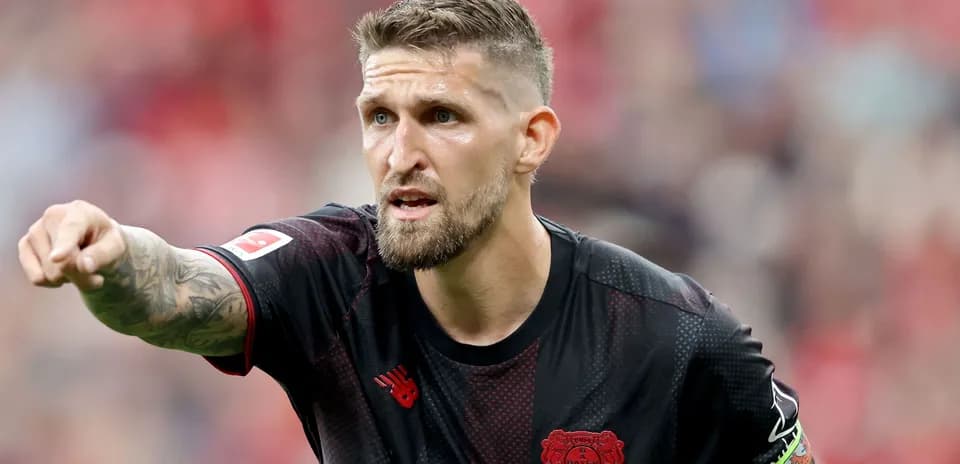 Player pointing during a match for Bayer Leverkusen