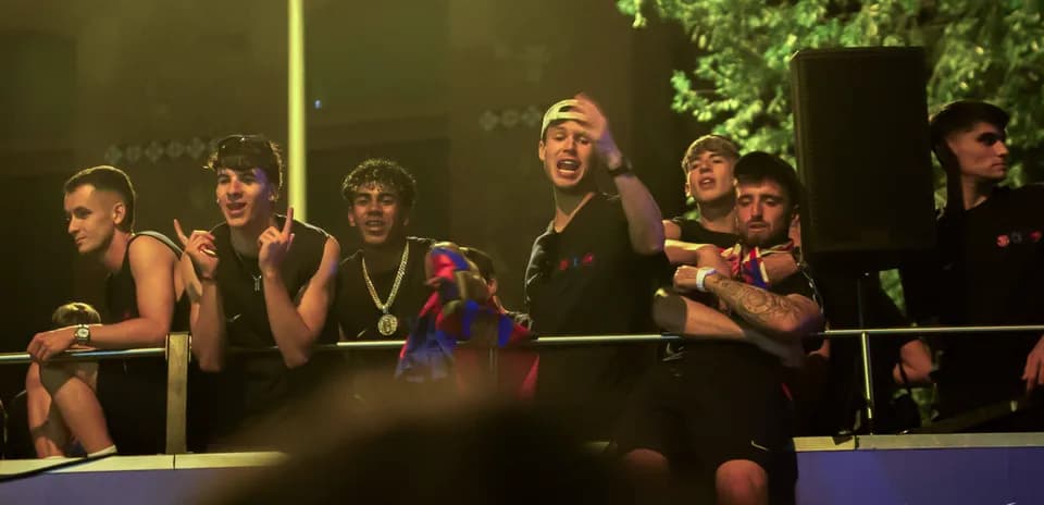 Group of young fans celebrating on balcony