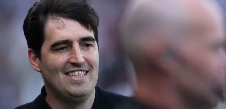 Coach smiling during match day preparations