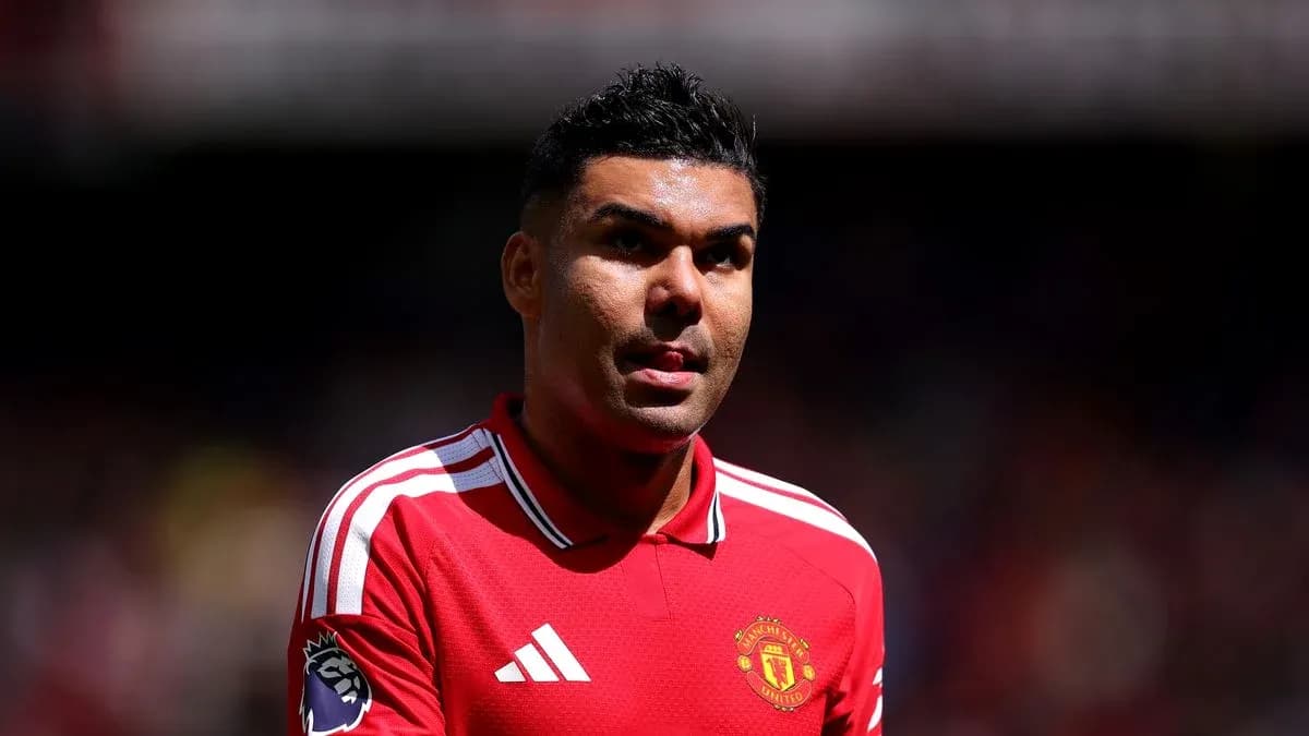 Player in Manchester United jersey on the pitch