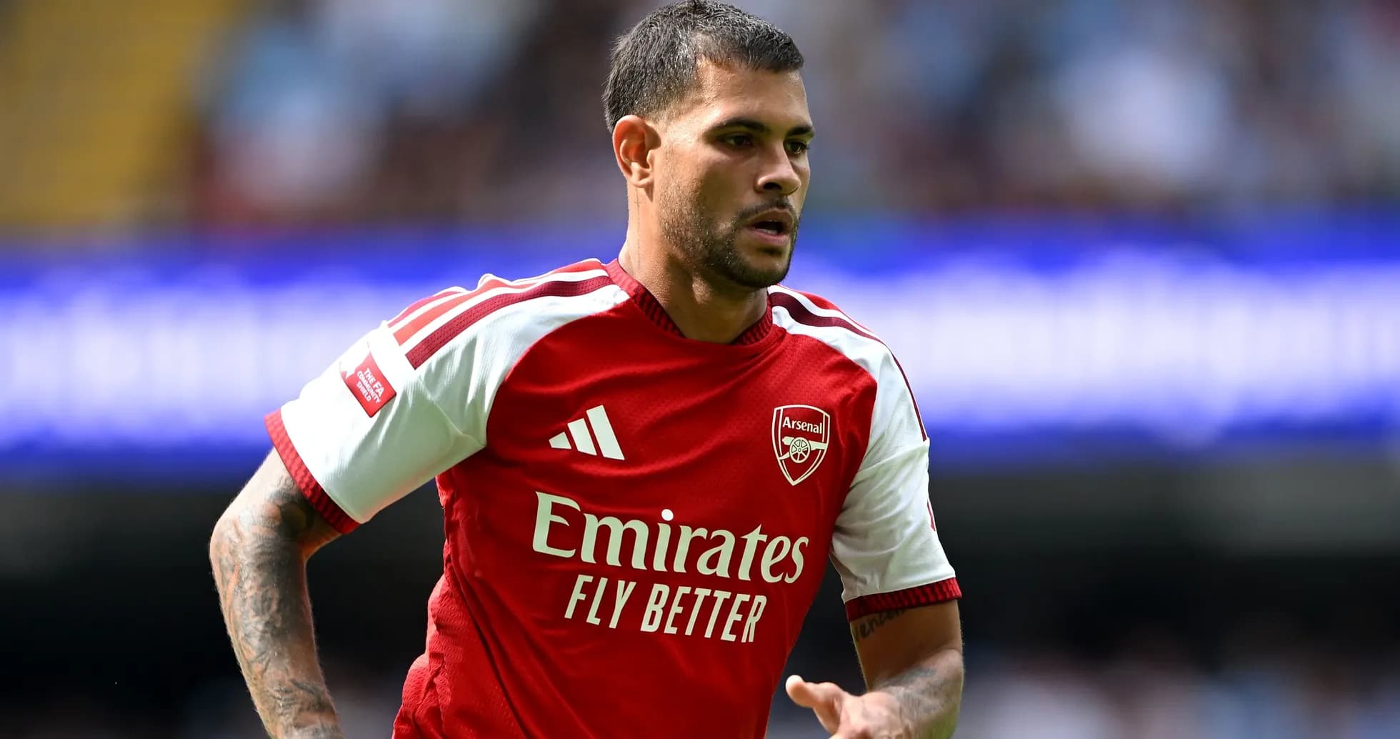 Player in Arsenal kit during match action