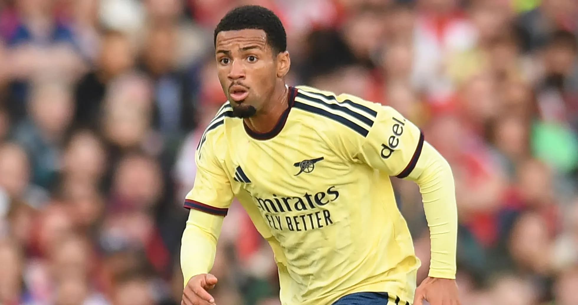 Player in Arsenal jersey running during a match