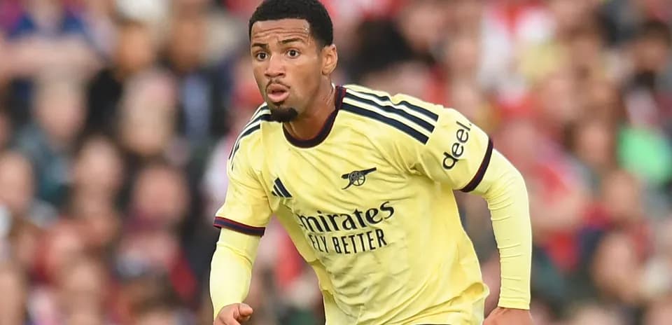 Player in Arsenal jersey running during a match