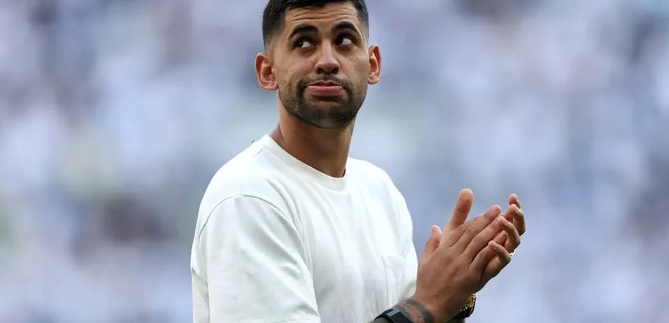 Player applauding to the crowd at the stadium