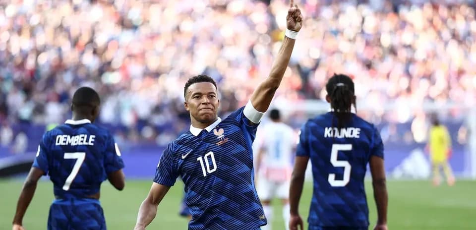 Kylian Mbappé celebrating a goal with teammates