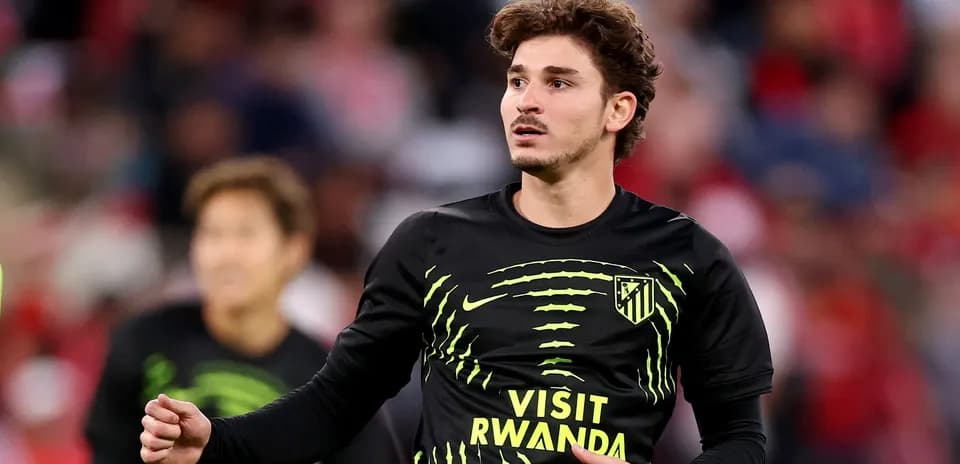 Player warming up in Atletico Madrid training kit