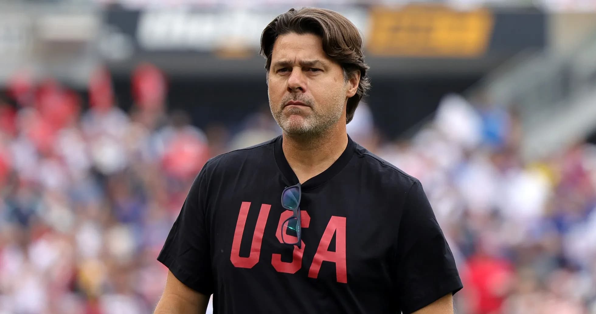 Coach wearing USA shirt on the field