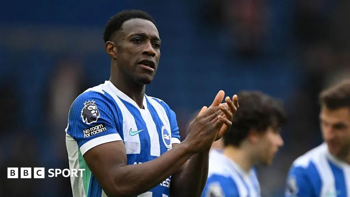 Player applauding fans during post-match celebration