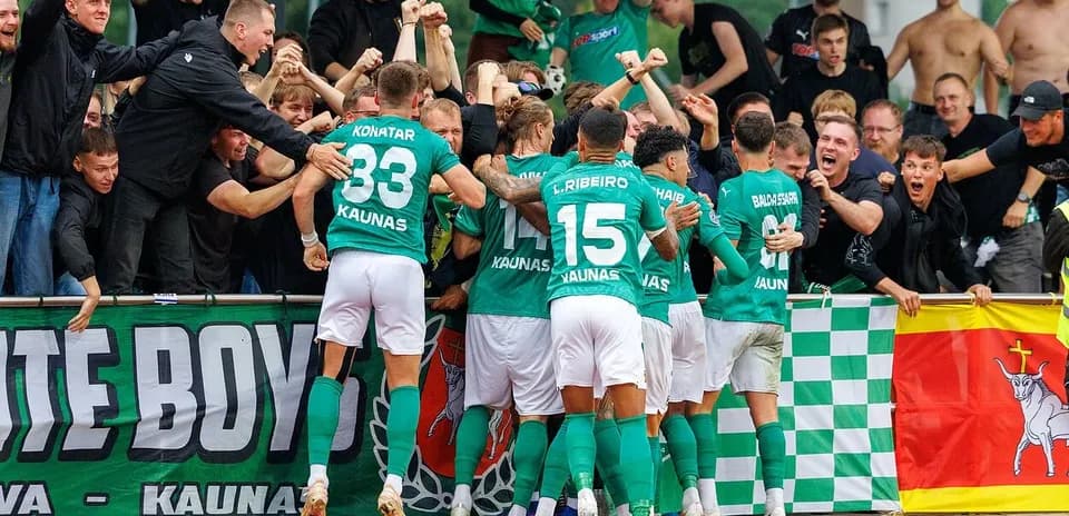 Žalgiris players celebrating with fans after a goal