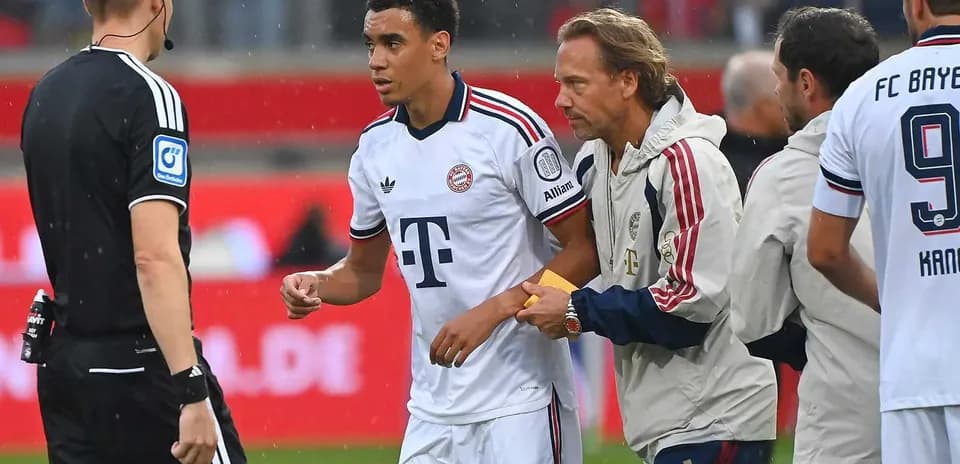 Player receiving instructions from coach during match