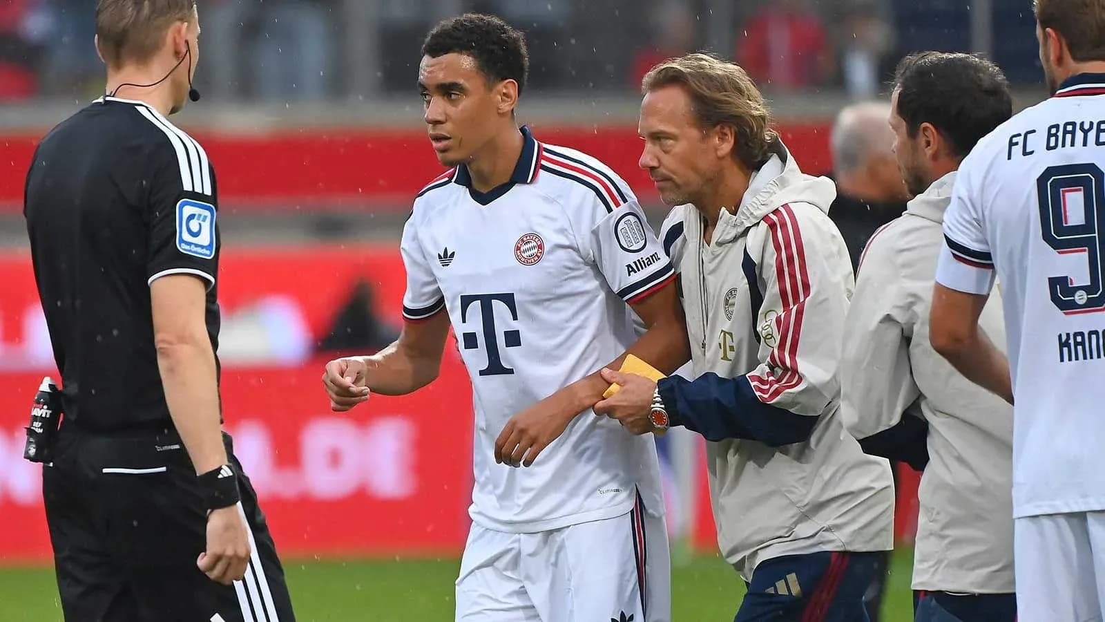 Player receiving instructions from coach during match