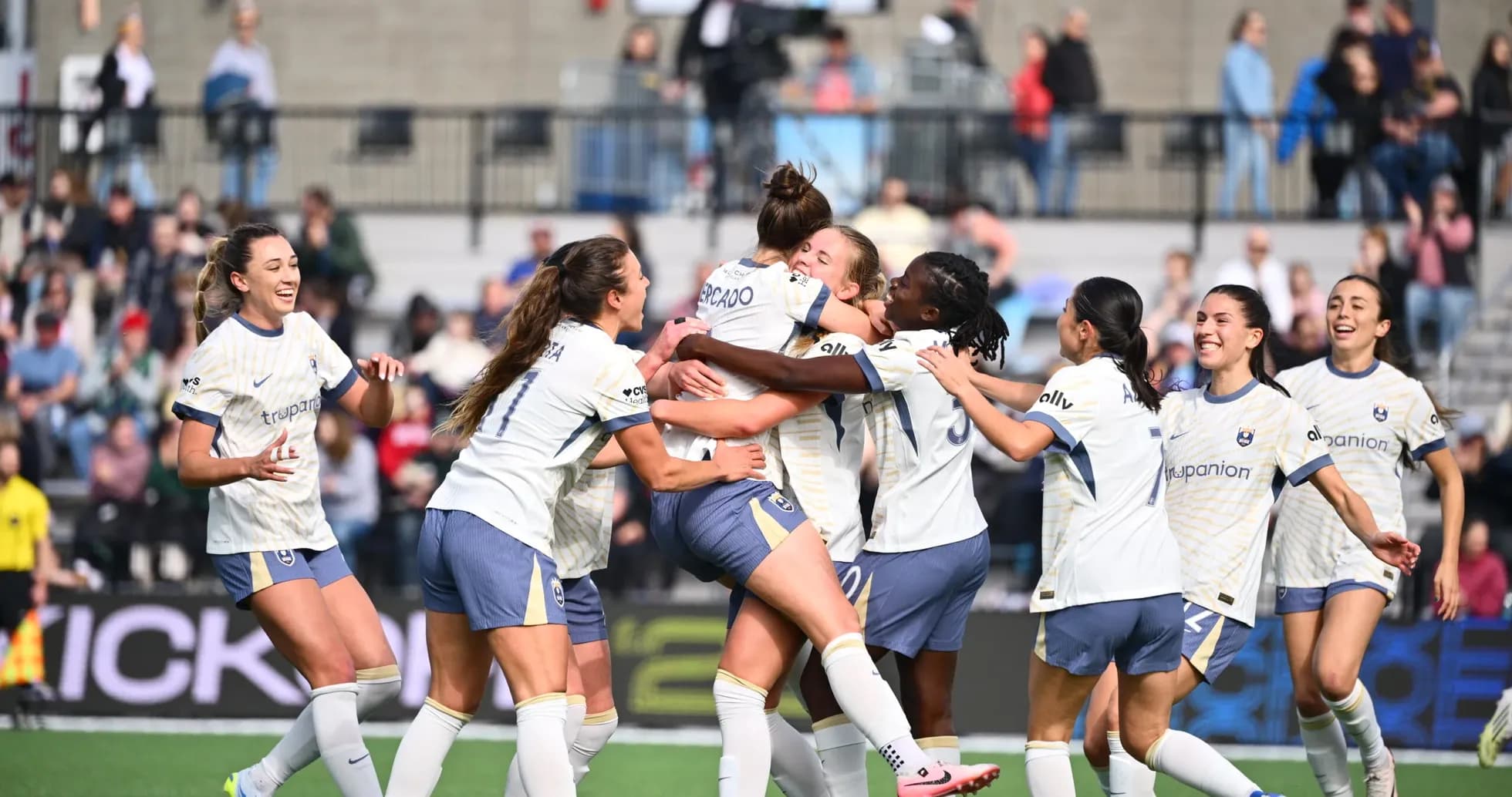 Players celebrating a goal during match