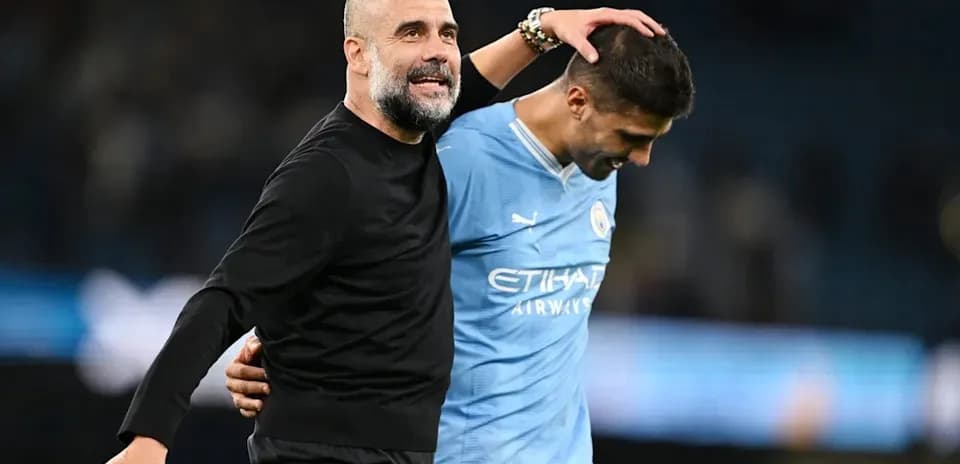 Coach and player celebrating after match victory