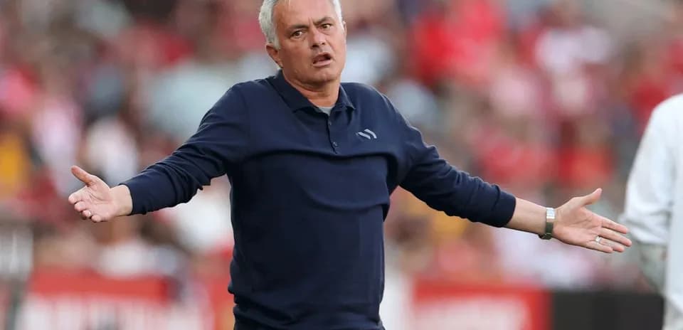 Coach gesturing during a football match