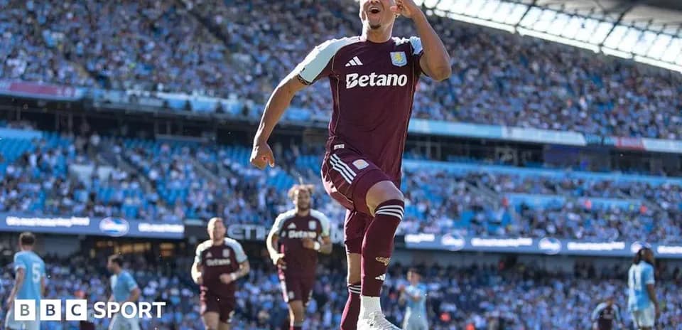 Aston Villa player celebrating a goal in stadium