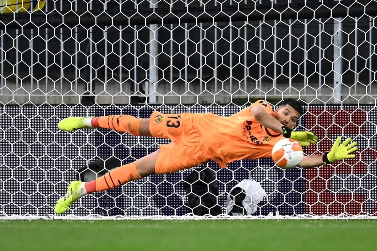 Goalkeeper diving to save a penalty kick