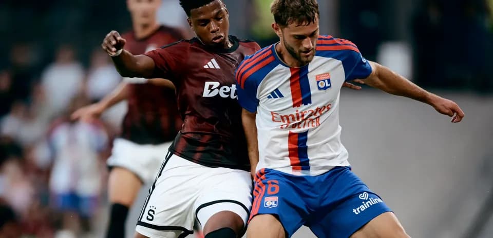Lyon player battling for the ball against Sparta Praha