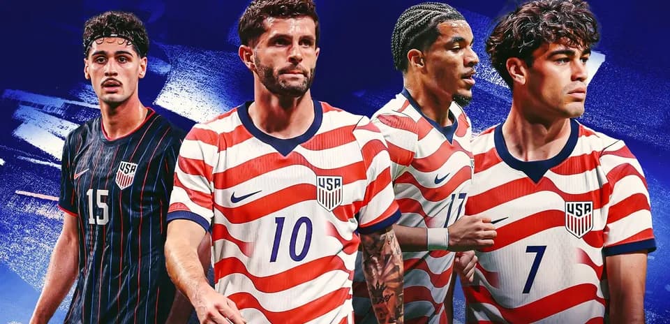 Four soccer players in USA jerseys posing together