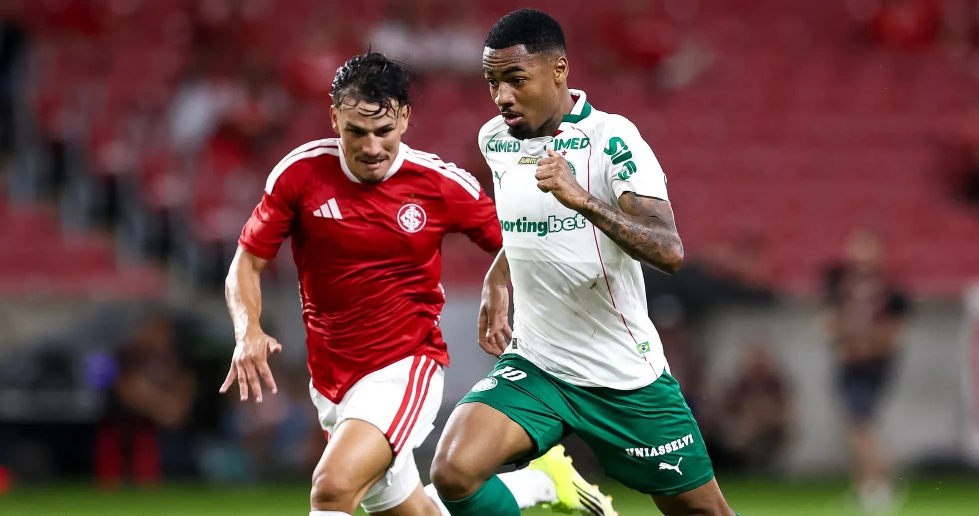 Two players competing for the ball during match
