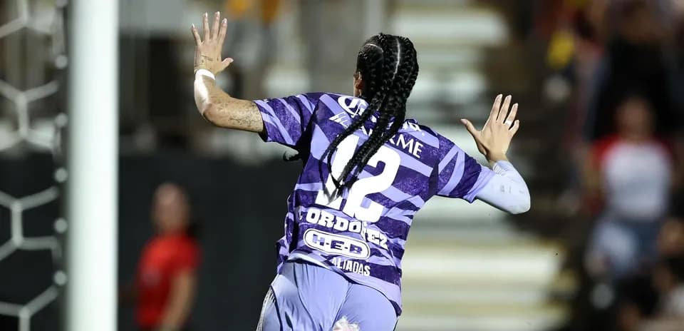 Player celebrating a goal during Liga MX match