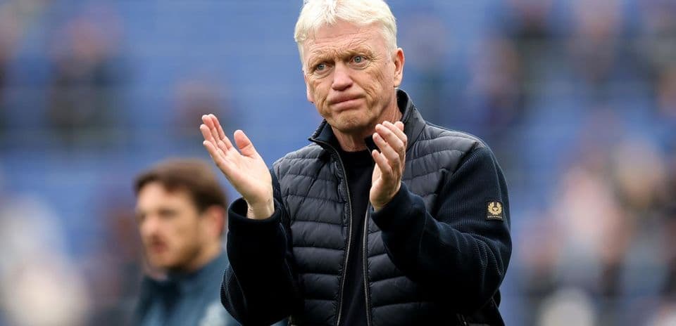 Manager applauding on the sidelines during match
