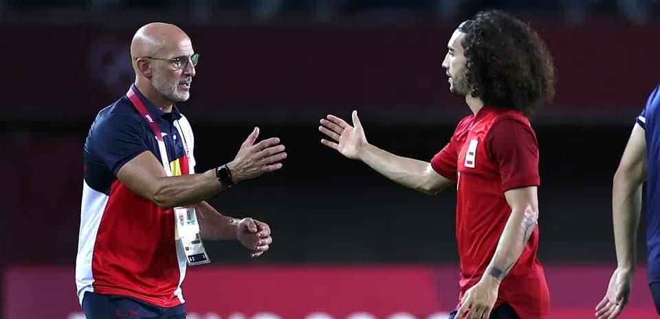 Coach and player shaking hands during match