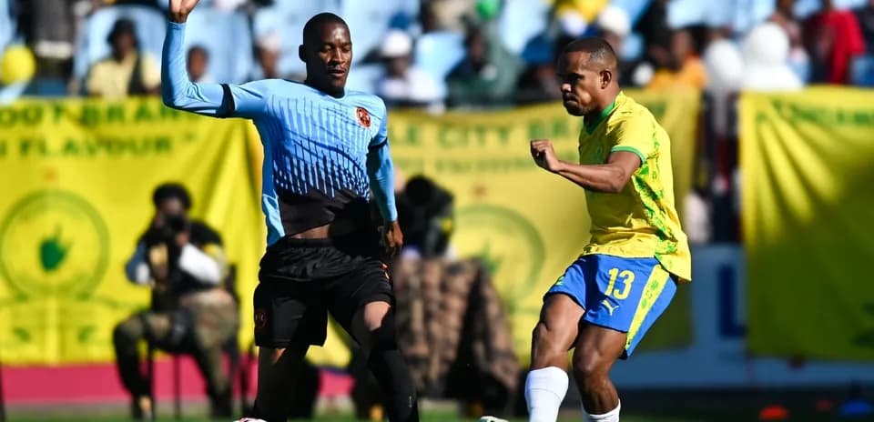 Player kicking the ball during a soccer match