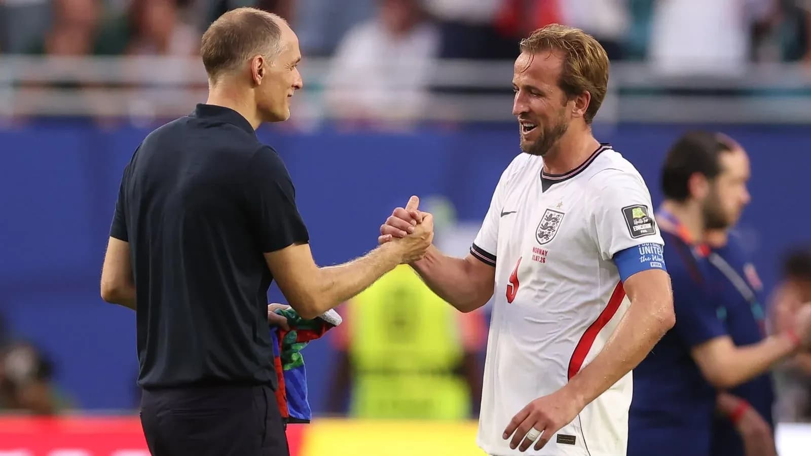 Coach and player shaking hands after match
