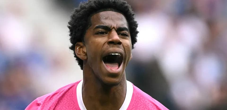 Player in pink jersey shouting during match