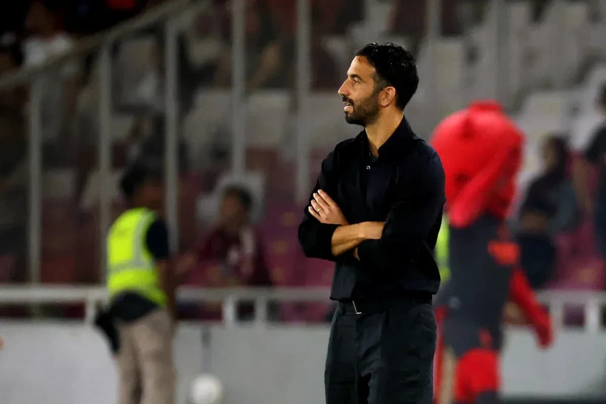 Coach observing the match from the sidelines