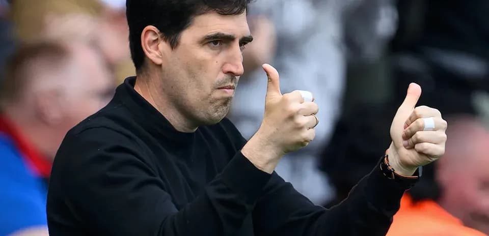 Coach giving thumbs up during match