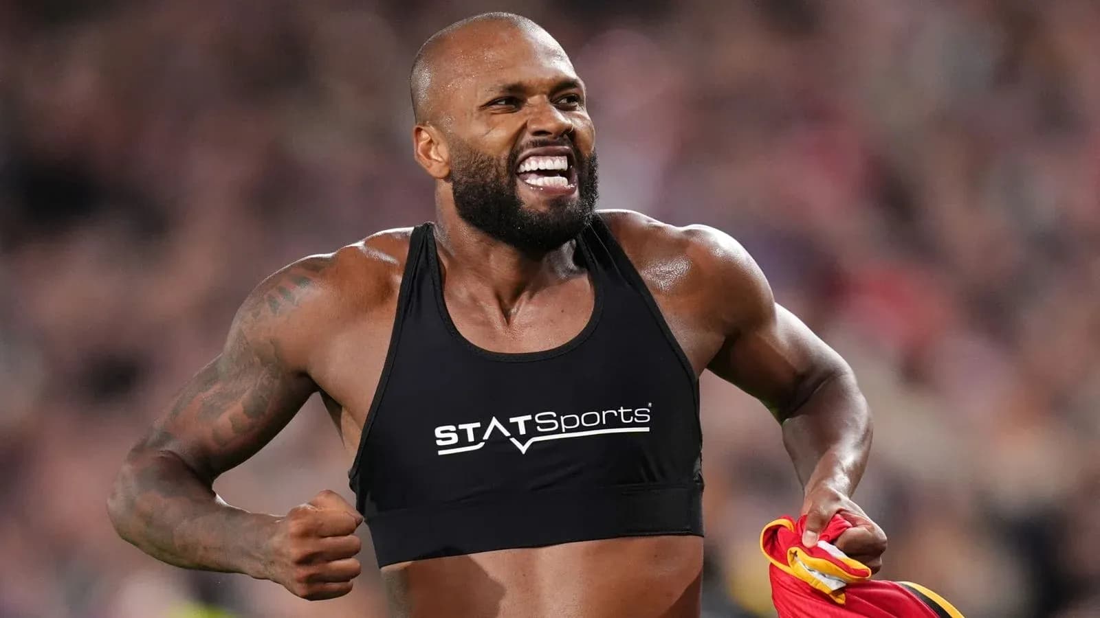 Athlete celebrating with jersey after a competition