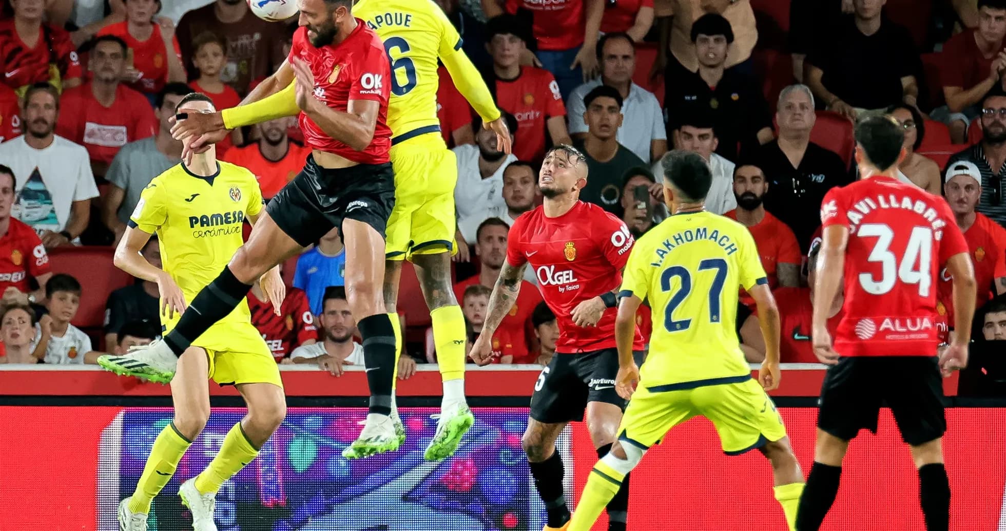 Players contesting a header during Mallorca vs Villarreal
