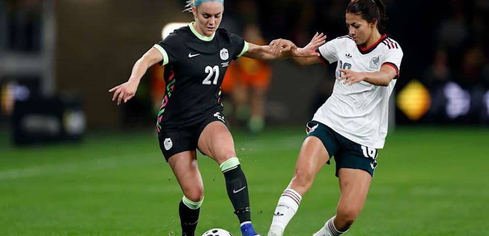 Players battling for the ball during soccer match