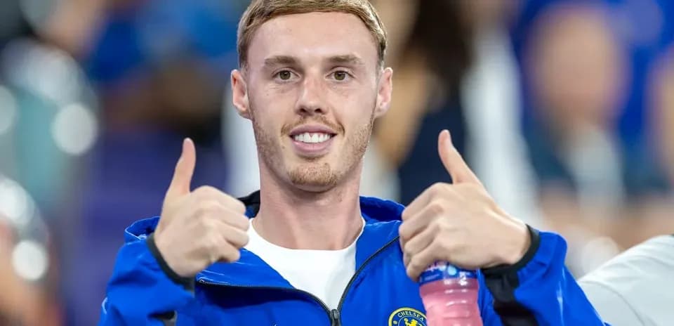 Player giving thumbs up in Chelsea jacket