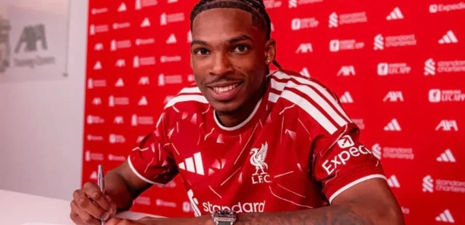 Player signing contract at Liverpool FC announcement