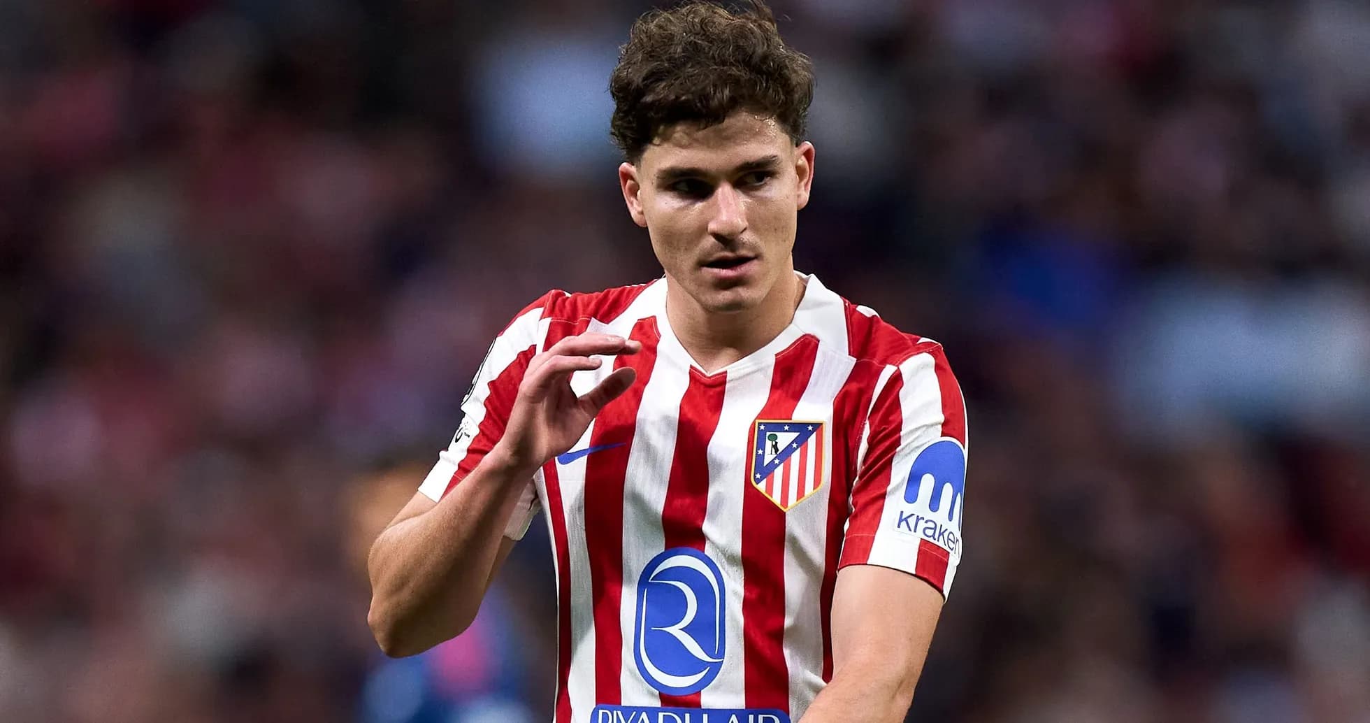 Atletico Madrid player gesturing during match