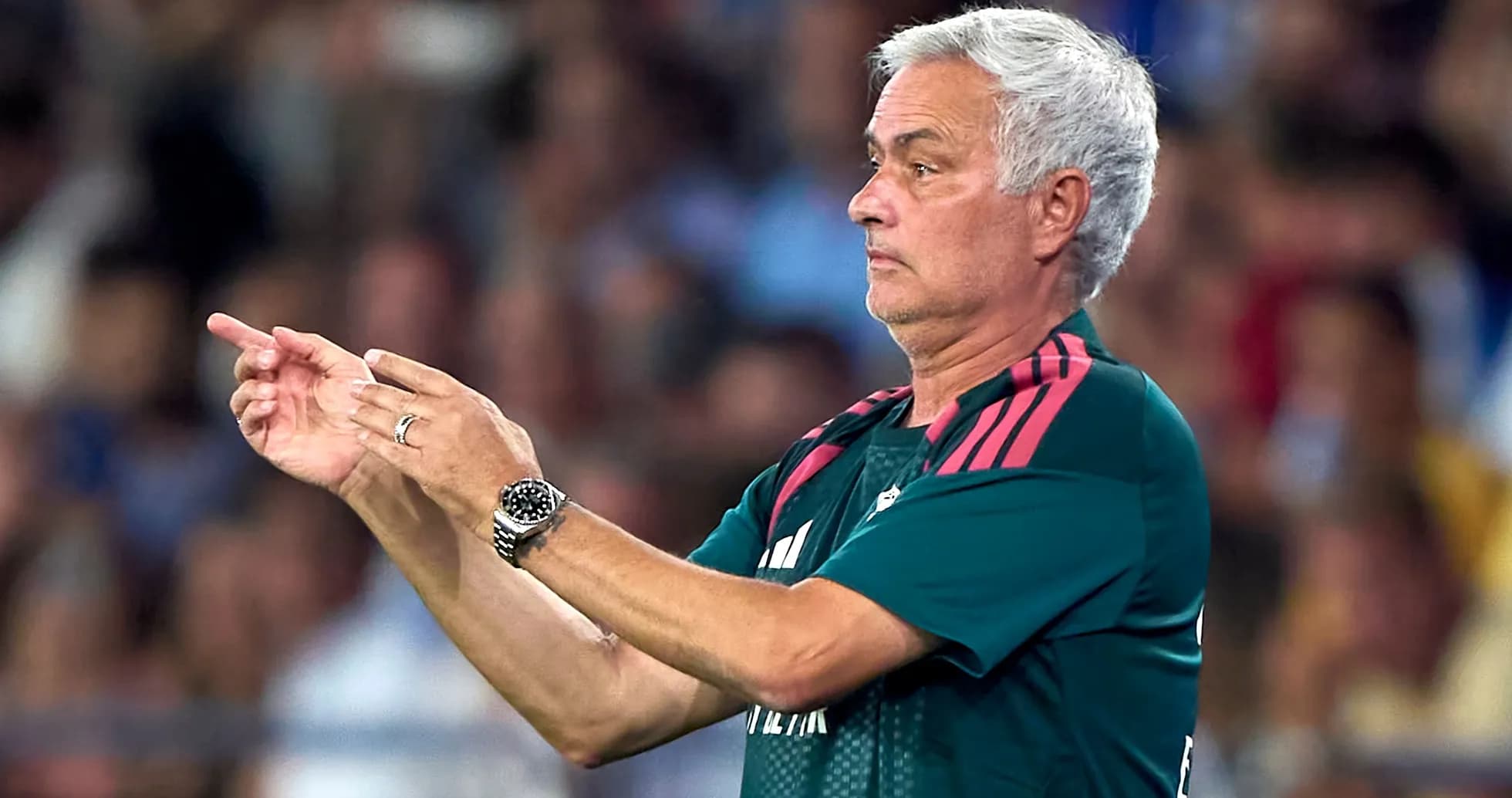 Coach giving instructions during a football match