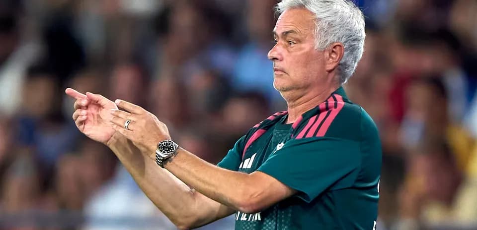 Coach giving instructions during a football match