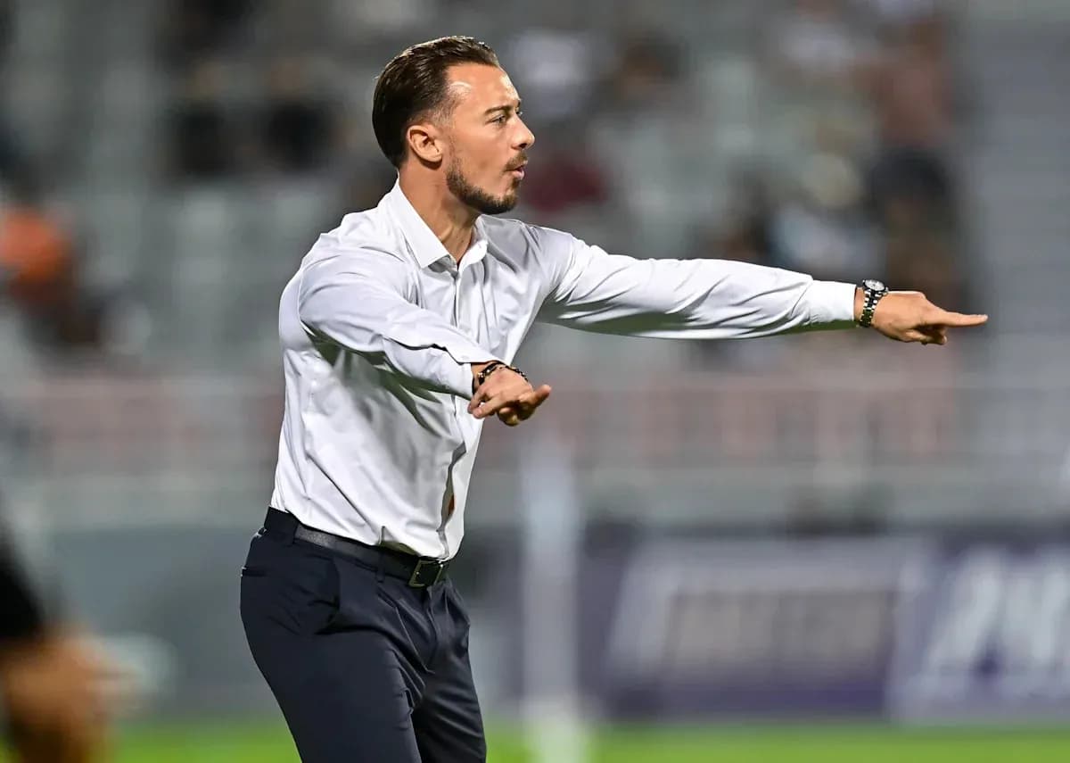 Coach giving instructions during a football match