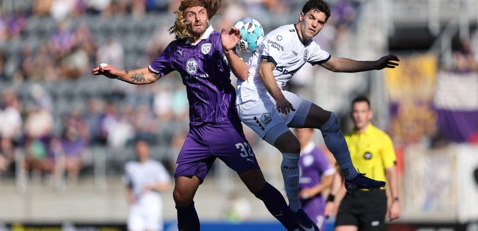Players contesting for the ball during match