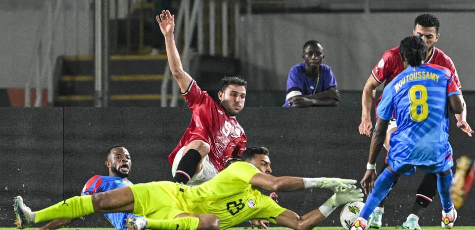 Players contesting a loose ball near the goal