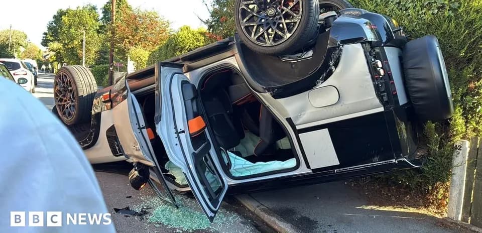 Upside-down car on side of the road