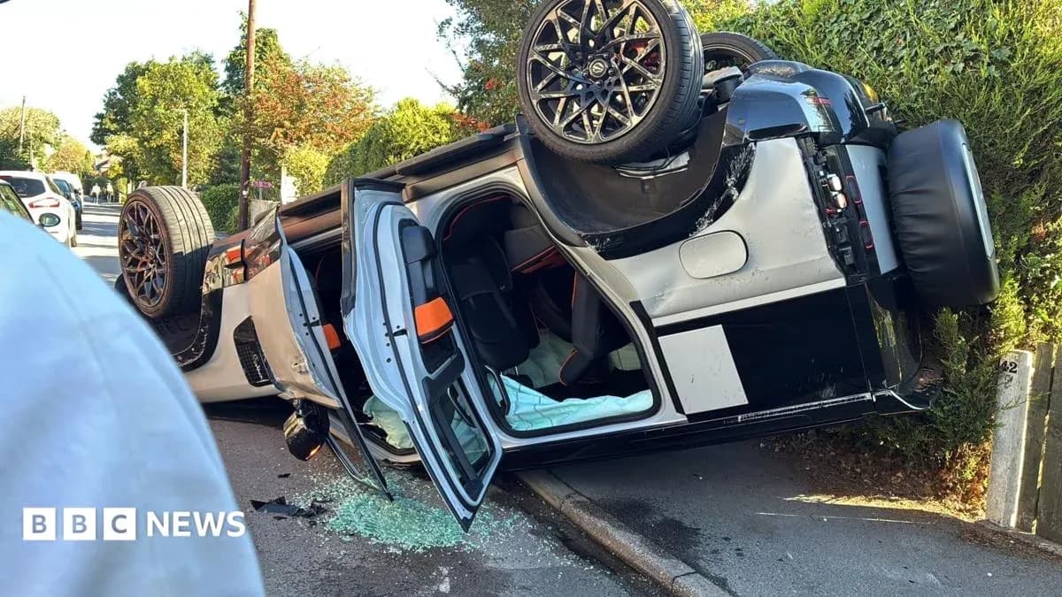 Upside-down car on side of the road