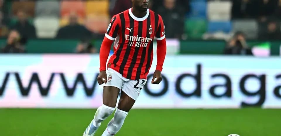 AC Milan player running with the ball on field