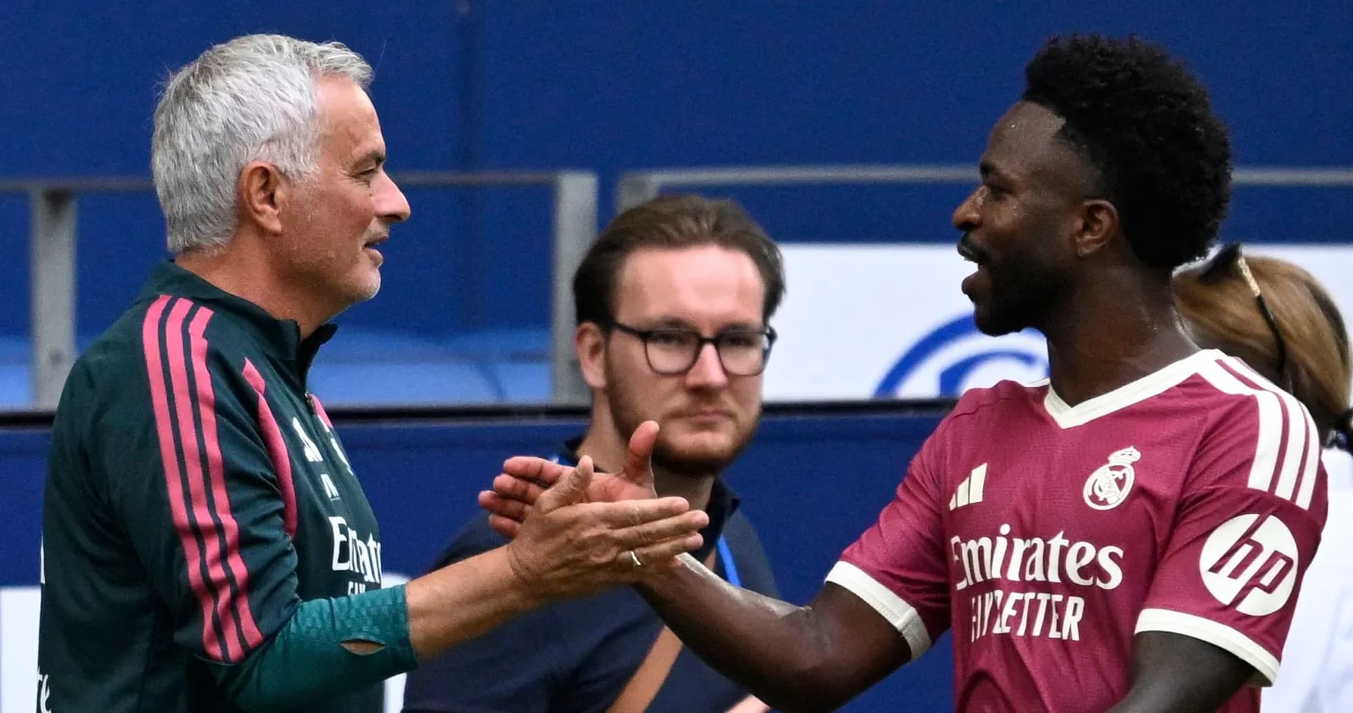 Coach and player shaking hands after match
