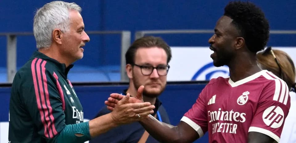 Coach and player shaking hands after match