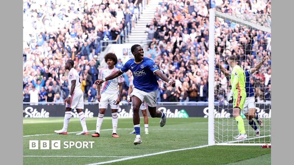 Player celebrating a goal with fans in background